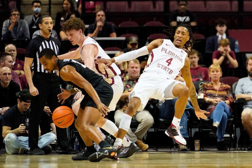 A Florida State player attempts to take a charge against Stetson.