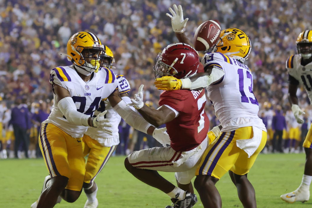 oe Foucha #13 and Jarrick Bernard-Converse #24 of the LSU Tigers breaks up a pass intended for Ja'Corey Brooks #7 of the Alabama Crimson Tide during overtime at Tiger Stadium