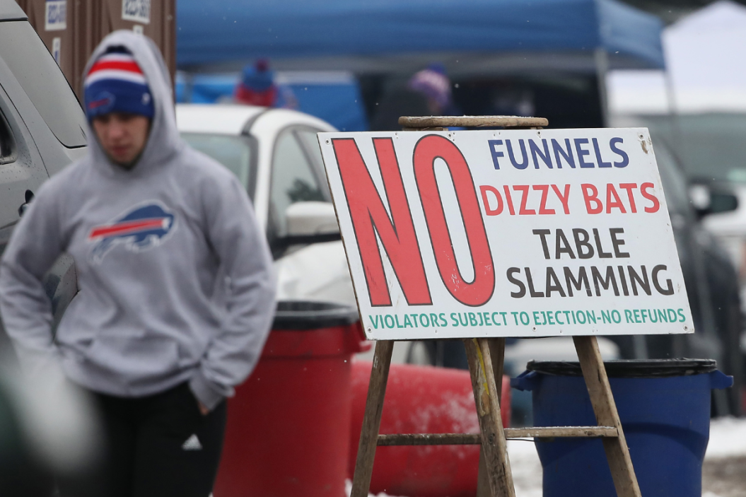 A sign notes the prohibition of table slamming and other activities as fans of the Buffalo Bills gather for tailgating activities prior to the Bills NFL game against the Miami Dolphins at New Era Field