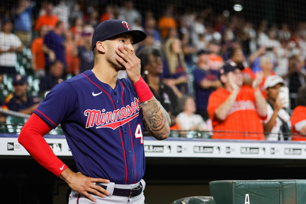 Carlos Correa #4 of the Minnesota Twins walks out of the dugout in his first visit back to Minute Maid Park to face the Houston Astros