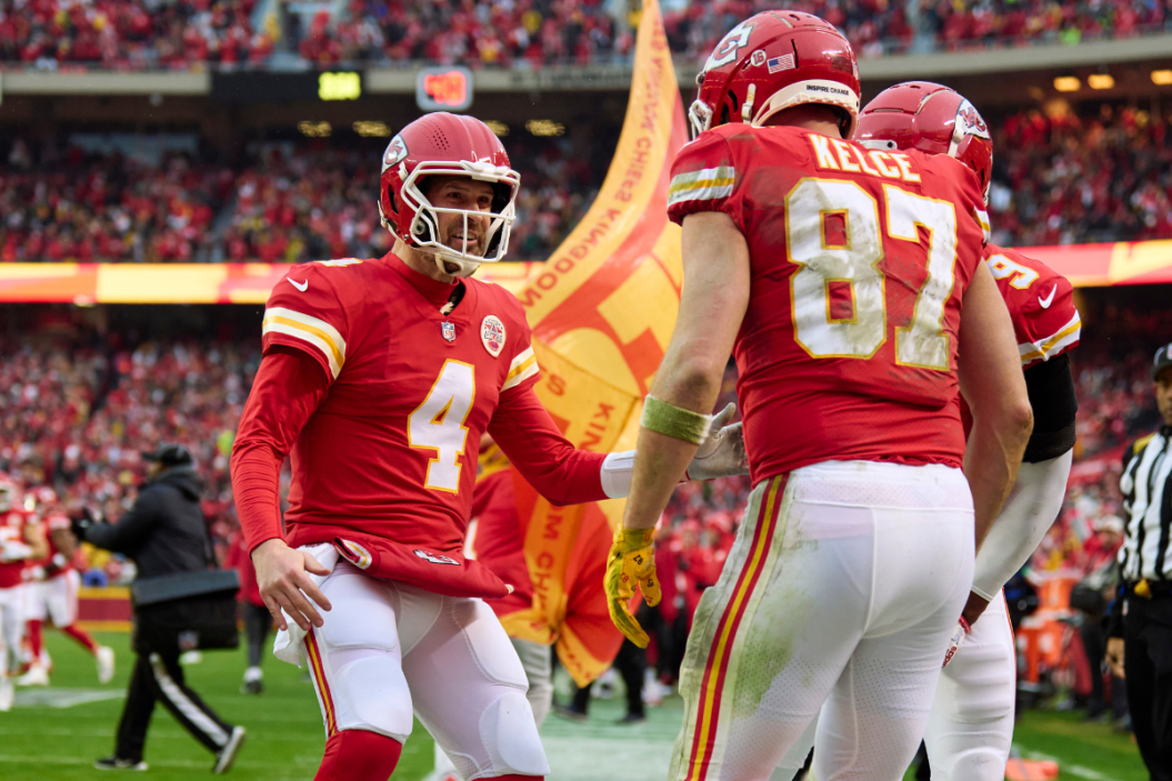 Chad Henne #4 of the Kansas City Chiefs celebrates with teammates after scoring a touchdown against the Jacksonville Jaguars during the first half at GEHA Field at Arrowhead Stadium