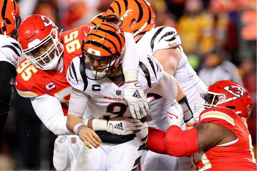Chris Jones #95 of the Kansas City Chiefs tackles Joe Burrow #9 of the Cincinnati Bengals during the fourth quarter in the AFC Championship Game at GEHA Field at Arrowhead Stadium