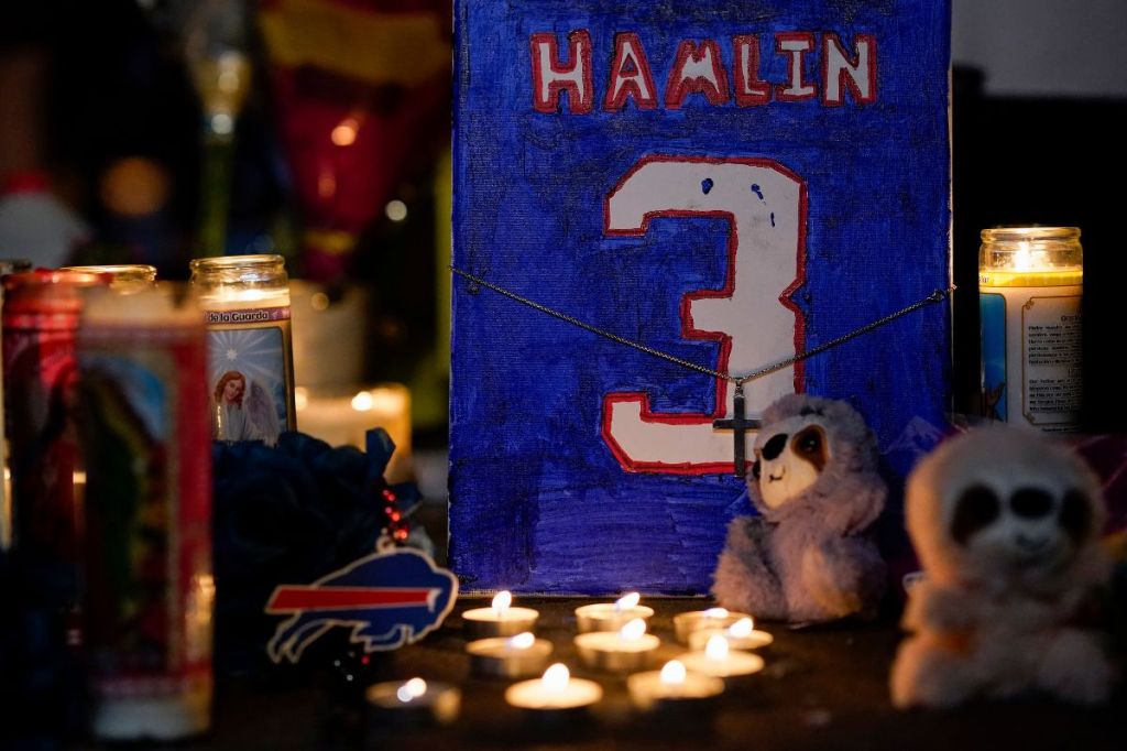 A detail as fans hold a candlelight vigil for Buffalo Bills safety Damar Hamlin at University of Cincinnati Medical Center