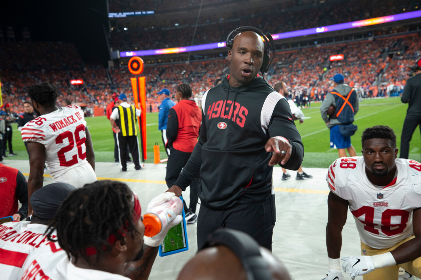 Defensive Coordinator DeMeco Ryans of the San Francisco 49ers talks with the defense on the sideline during the game against the Denver Broncos