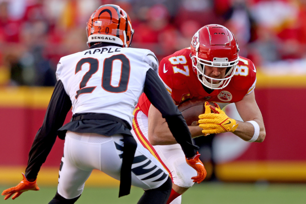 Tight end Travis Kelce #87 of the Kansas City Chiefs catches a second quarter pass in front of cornerback Eli Apple #20 of the Cincinnati Bengals in the AFC Championship Game