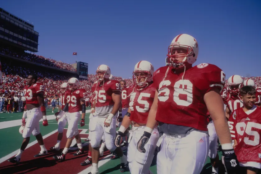 Nebraska football players pose before a game in 1995.