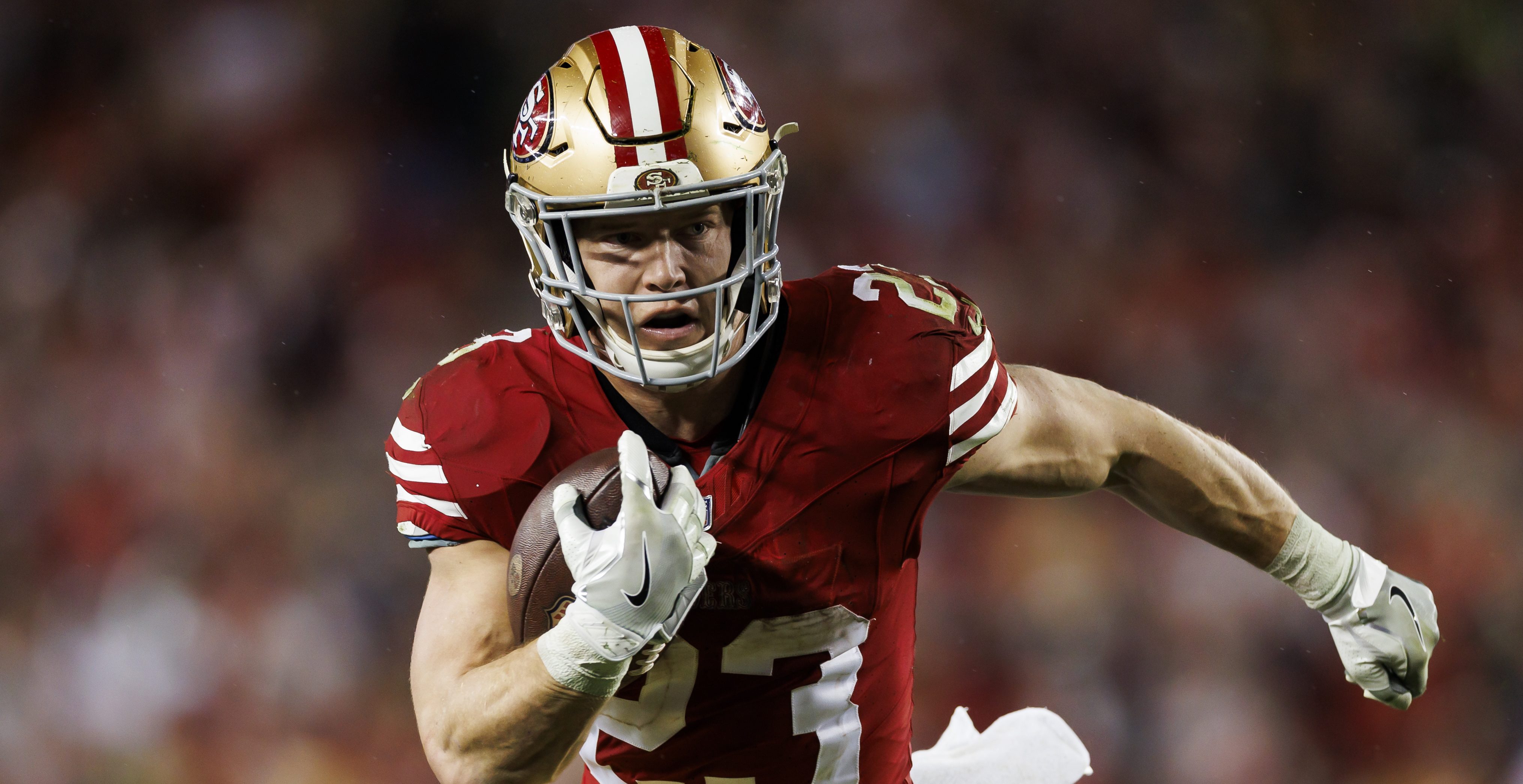 SANTA CLARA, CALIFORNIA - JANUARY 20: Christian McCaffrey #23 of the San Francisco 49ers carries the ball on a run play during an NFC divisional round playoff football game against the Green Bay Packers at Levi's Stadium on January 20, 2024 in Santa Clara, California.