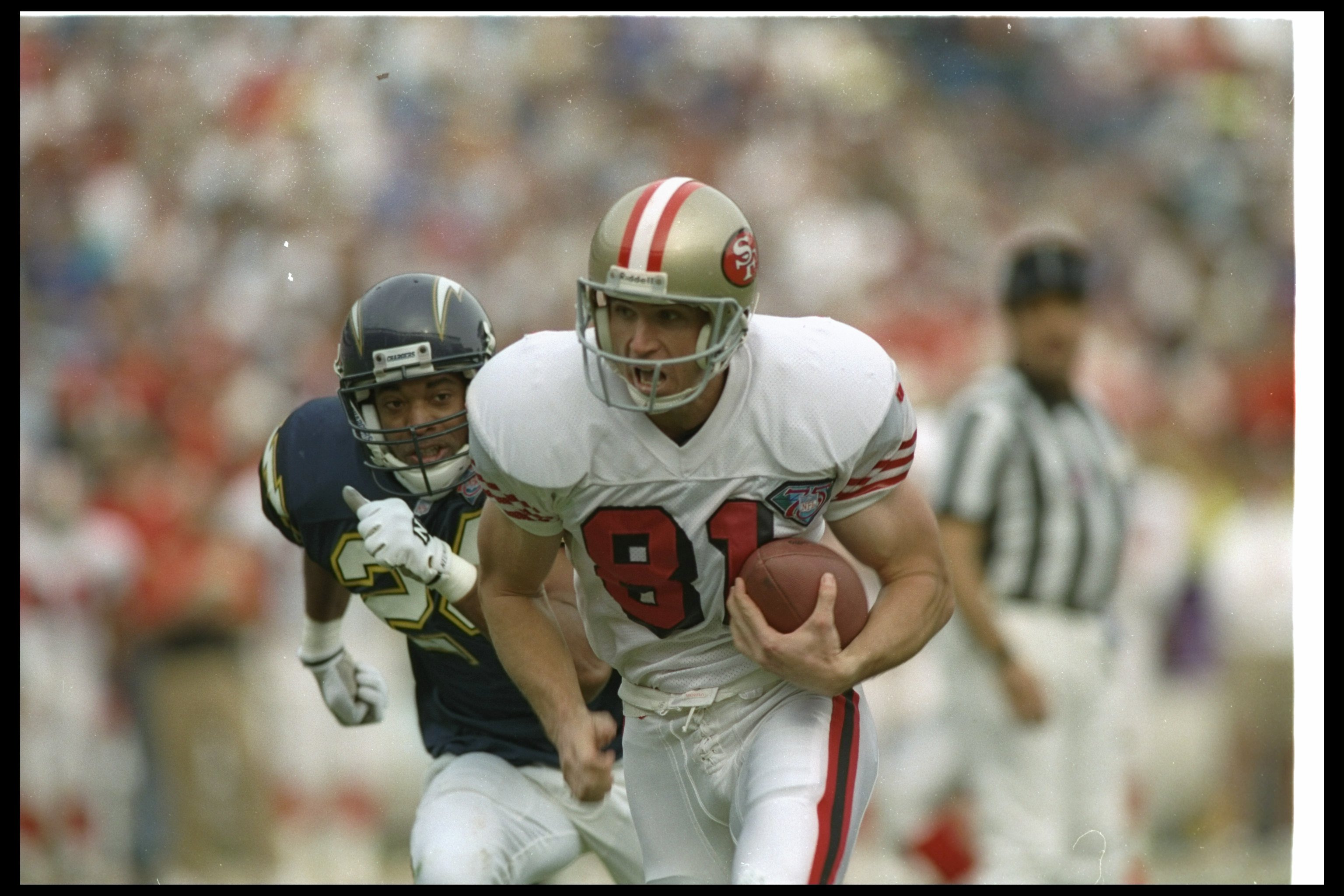 11 Dec 1994: Wide receiver Ed McCaffrey of the San Francisco 49ers moves the ball during a game against the San Diego Chargers at Jack Murphy Stadium in San Diego, California. The 49ers won the game, 38-15.