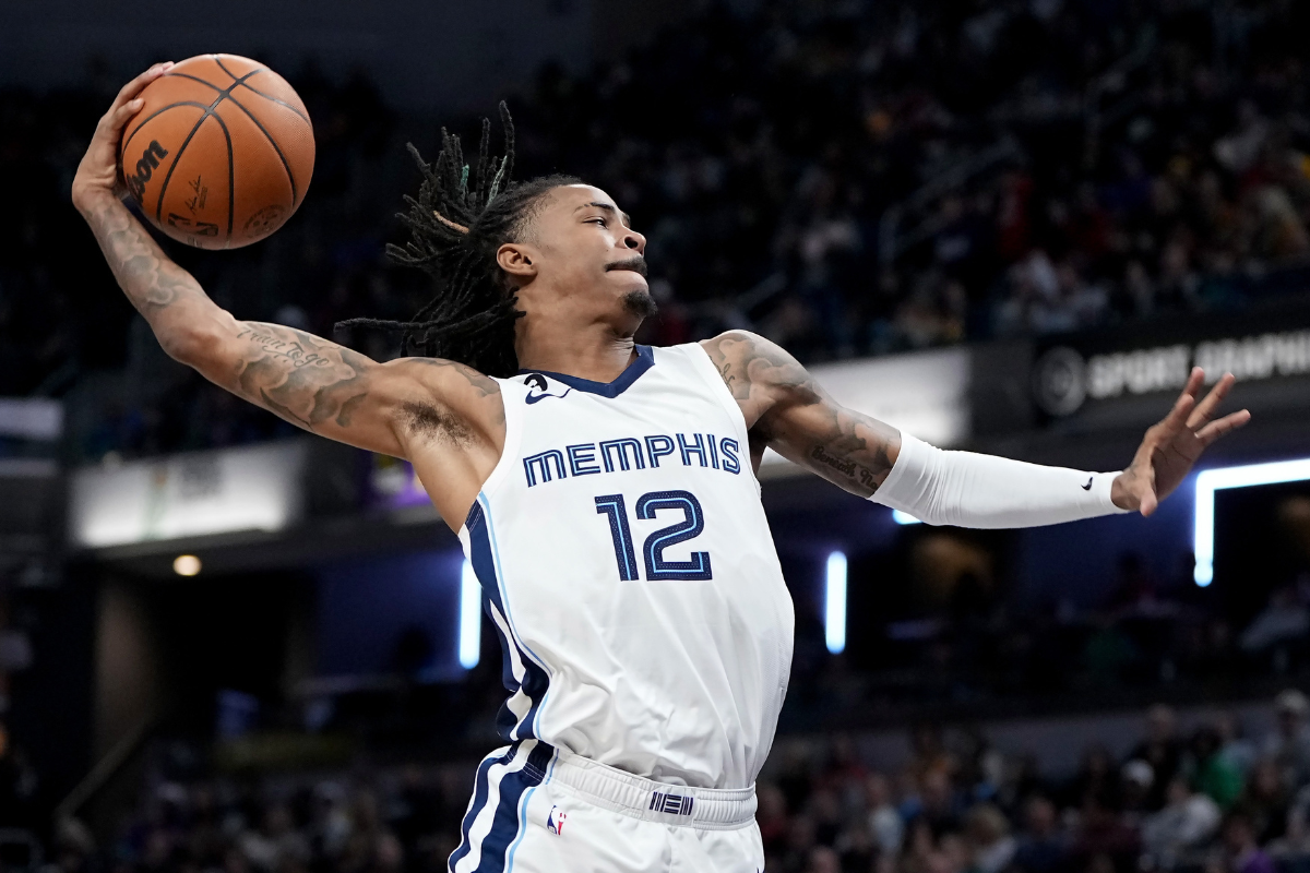 Ja Morant #12 of the Memphis Grizzlies dunks the ball in the third quarter against the Indiana Pacers at Gainbridge Fieldhouse