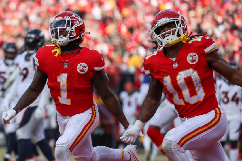 Kansas City Chiefs running back Jerick McKinnon (1) and running back Isiah Pacheco (10) run and smile to celebrate McKinnons 3-yard touchdown reception in the fourth quarter of an AFC West game