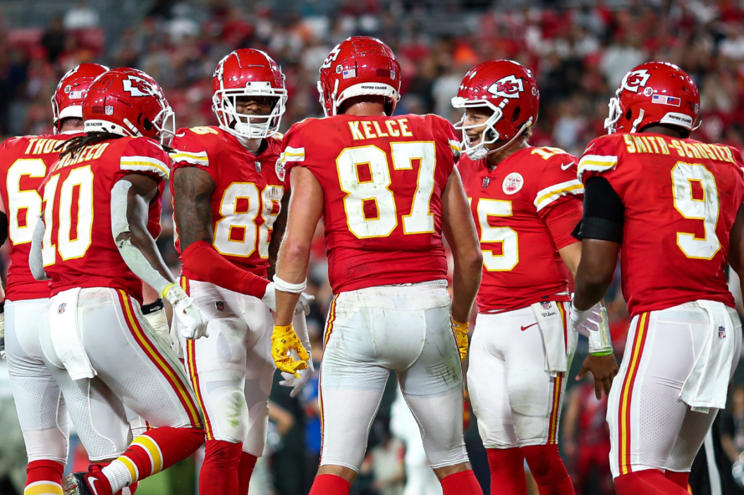 Jody Fortson #88 of the Kansas City Chiefs celebrates with JuJu Smith-Schuster #9, Patrick Mahomes #15, Isiah Pacheco #10, Joe Thuney #62, and Travis Kelce #87 after scoring a touchdown during an NFL football game