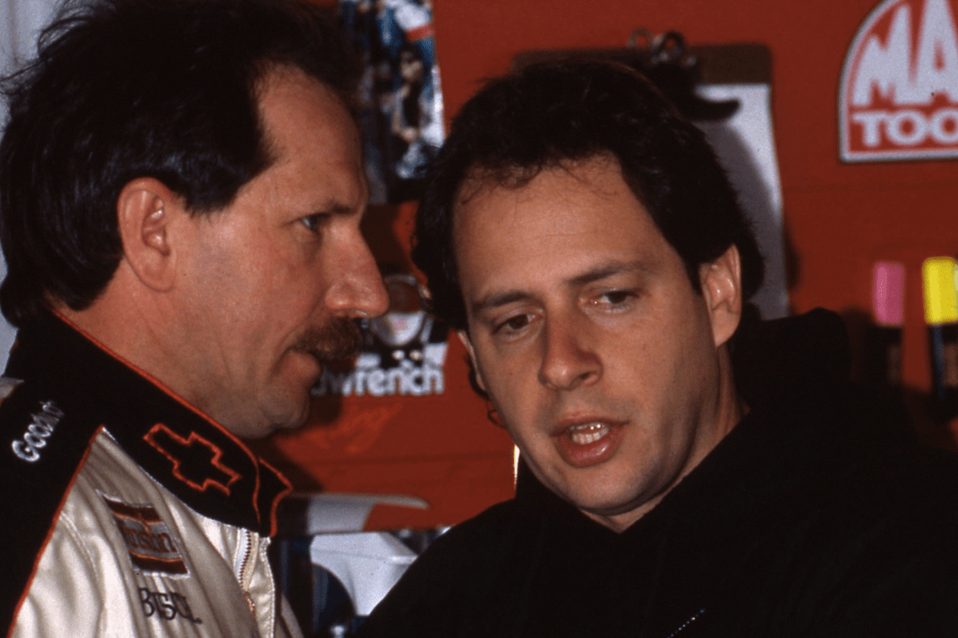 Kirk Shelmerdine talks to Dale Earnhardt Sr. in the garage before a race in 1990