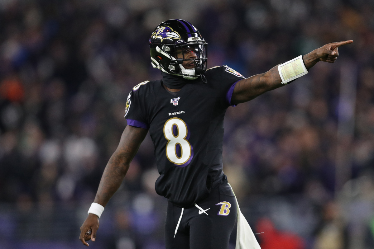Quarterback Lamar Jackson #8 of the Baltimore Ravens celebrates after a touchdown in the first quarter of the game against the New York Jets at M&T Bank Stadium