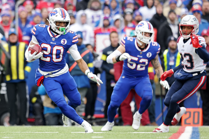 Nyheim Hines #20 of the Buffalo Bills returns the opening kickoff for a touchdown during the first quarter against the New England Patriots at Highmark Stadium