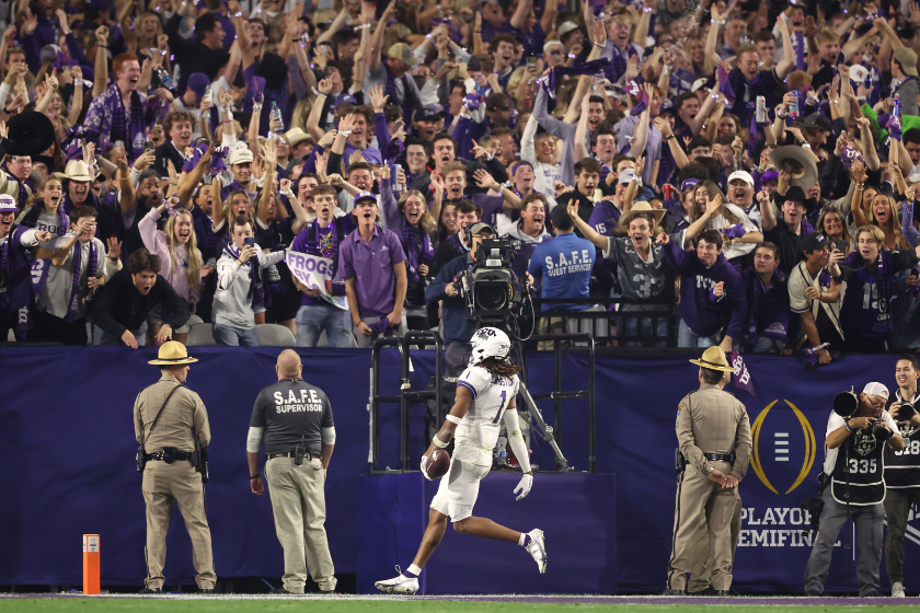 Quentin Johnston #1 of the TCU Horned Frogs reacts after a touchdown during the fourth quarter against the Michigan Wolverines in the Vrbo Fiesta Bowl at State Farm Stadium.