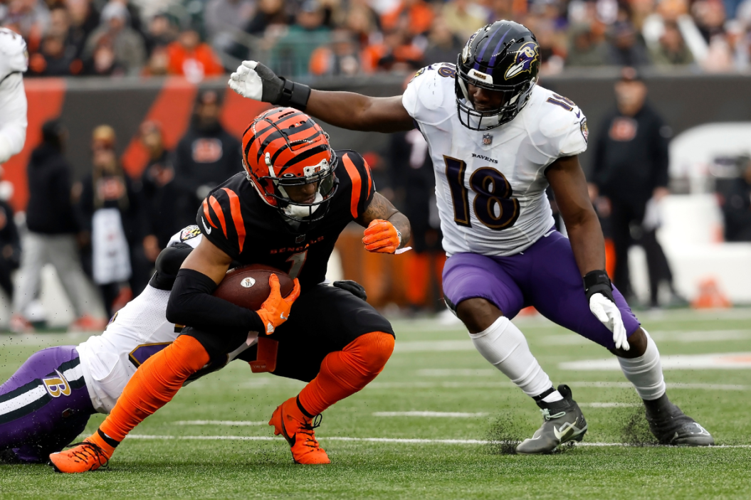 Roquan Smith #18 of the Baltimore Ravens tackles Ja'Marr Chase #1 of the Cincinnati Bengals during the game at Paycor Stadium