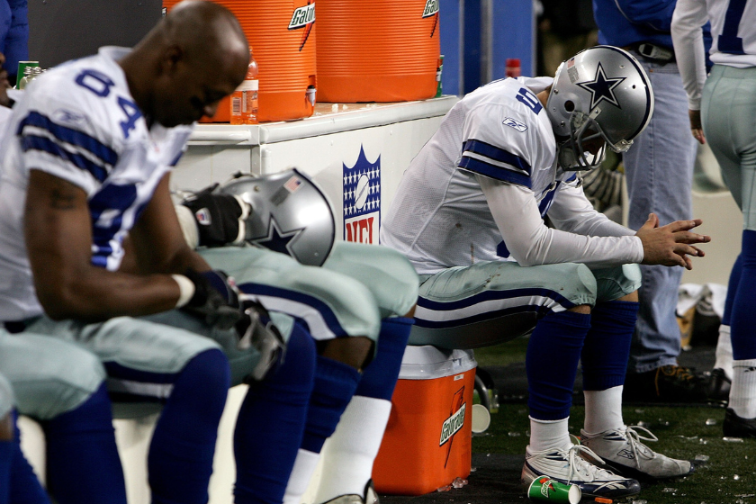 Quarterback Tony Romo #9 of the Dallas Cowboys sits dejected after fumbling the field goal snap in the fourth quarter of the NFC Wild Card Playoff Game against the Seattle Seahawks 