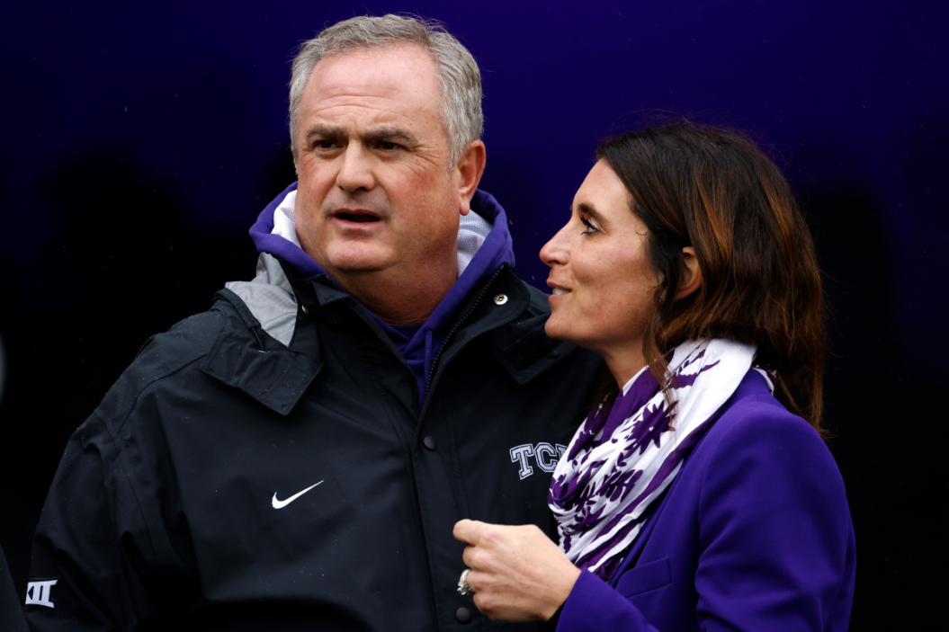 TCU head coach Sonny Dykes and wife Kate near the field before the game against the Iowa State Cyclones at Amon G. Carter Stadium