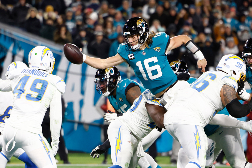 Trevor Lawrence #16 of the Jacksonville Jaguars dives for a two point con in the AFC Wild Card playoff game at TIAA Bank Field
