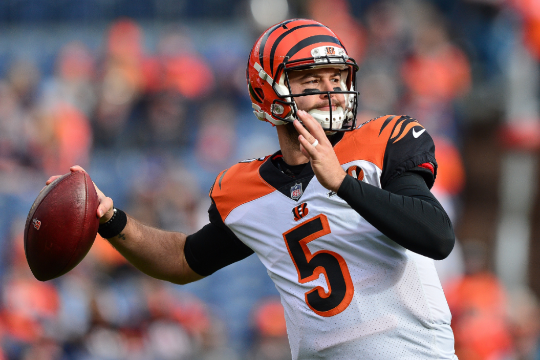 Quarterback AJ McCarron #5 of the Cincinnati Bengals throws as he warms up before a game against the Denver Broncos at Sports Authority Field at Mile High