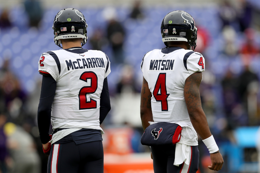 AJ McCarron #2 and Deshaun Watson #4 of the Houston Texans look on during warm ups prior to the game against the Baltimore Ravens