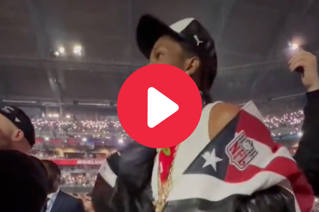 A$AP Rocky beaming while watching Rihanna perform at Super Bowl LVII.