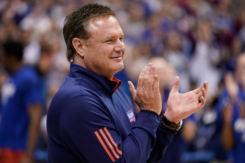 Head coach Bill Self of the Kansas Jayhawks applauds his team prior to a game against the Texas Tech Red Raiders at Allen Fieldhouse