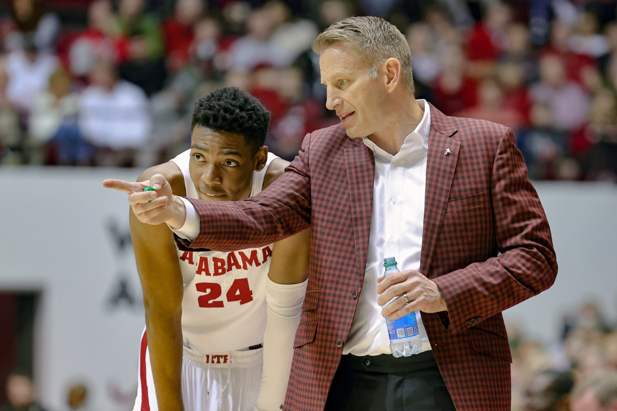 Head coach Nate Oats gives second period coaching advice to Brandon Miller #24 of the Alabama Crimson Tide during a time out against the LSU Tigers at Coleman Coliseum