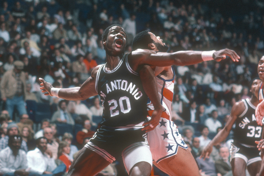 Gene Banks #20 of the San Antonio Spurs fights for position with Greg Ballard #42 of the Washington Bullets during an NBA basketball game circa 1982