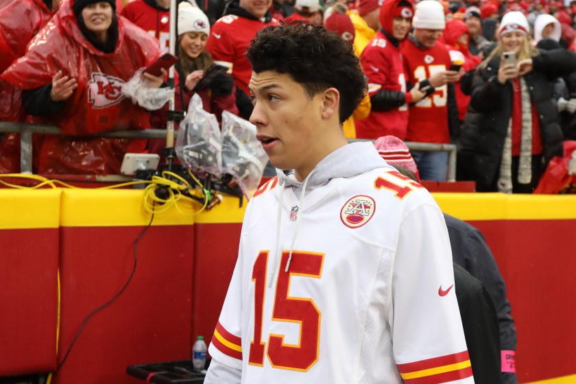 Jackson Mahomes walks the sidelines before a Chiefs game.