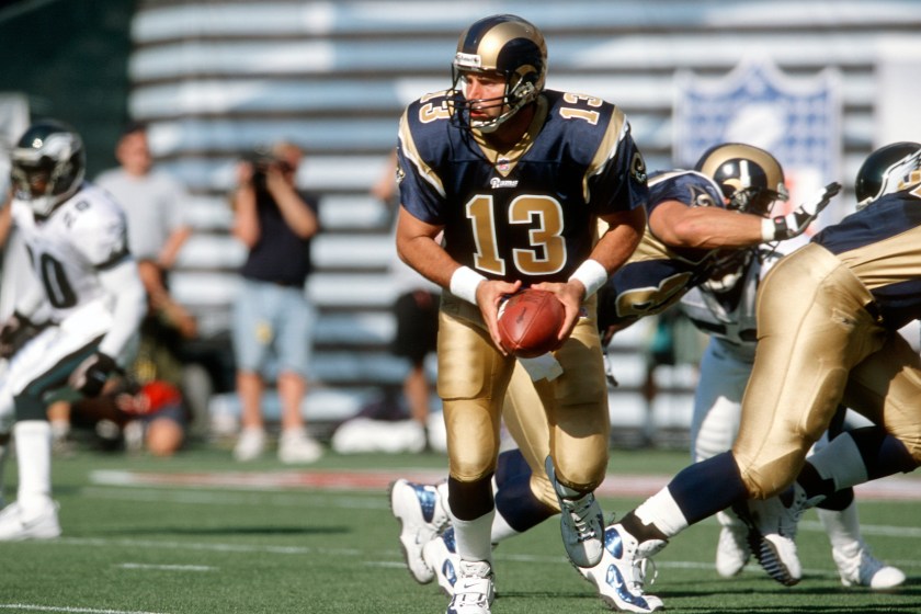 Kurt Warner drops back to pass with the Rams.