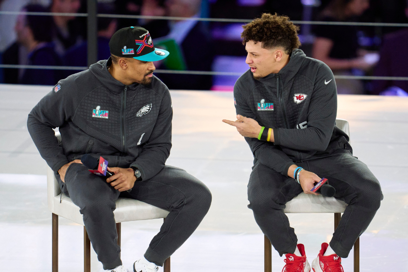 Jalen Hurts #1 of the Philadelphia Eagles speaks with Patrick Mahomes #15 of the Kansas City Chiefs at Footprint Center