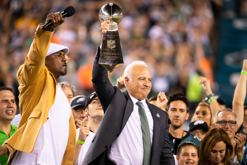 Philadelphia Eagles owner Jeffrey Lurie hoists the Vince Lombardi Trophy with hall of famer Brian Dawkins before the game against the Atlanta Falcons at Lincoln Financial Field