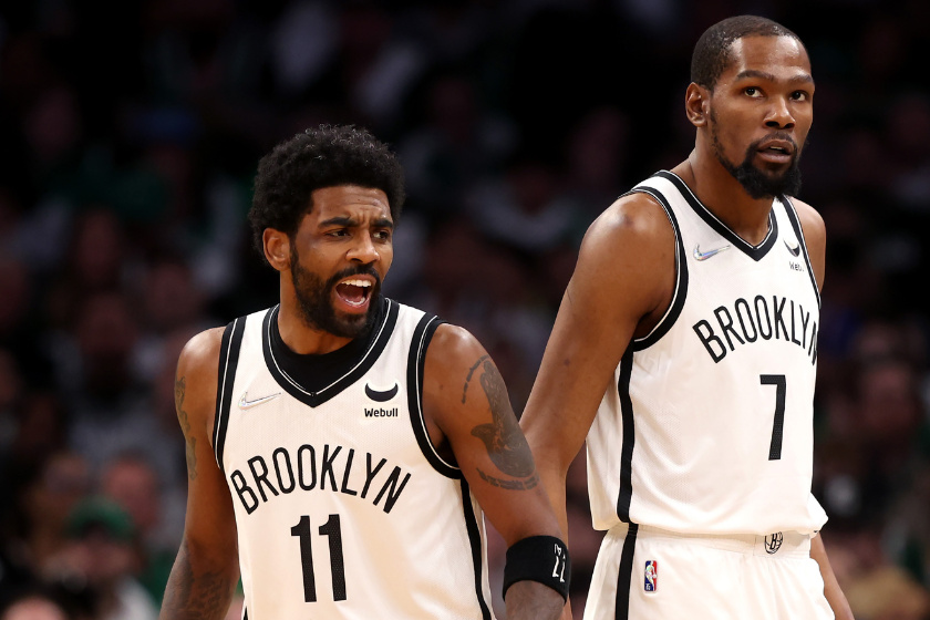 Kyrie Irving #11 of the Brooklyn Nets and Kevin Durant #7 look on during the first quarter of Round 1 Game 1 of the 2022 NBA Eastern Conference Playoffs 