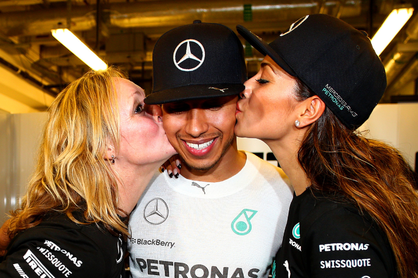 Lewis Hamilton of Great Britain and Mercedes GP celebrates with his stepmother Linda Hamilton and girlfriend Nicole Scherzinger after winning the World Championship after the Abu Dhabi Formula One Grand Prix 