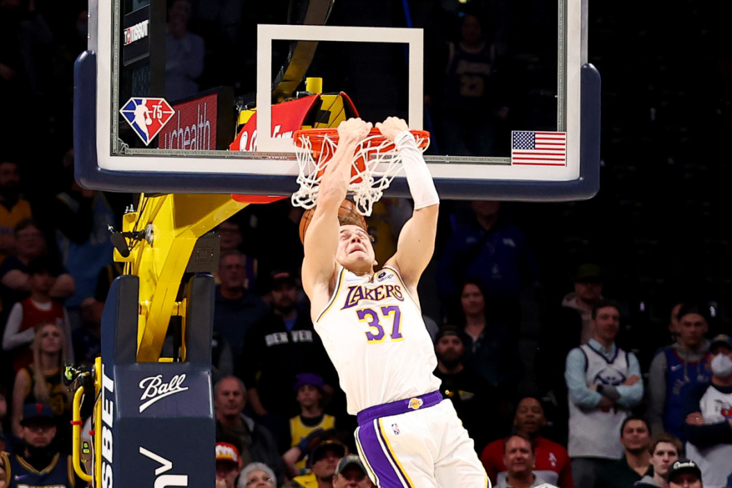 Mac McClung #37 of the Los Angeles Lakers dunks to finish the game against the Denver Nuggets at Ball Arena