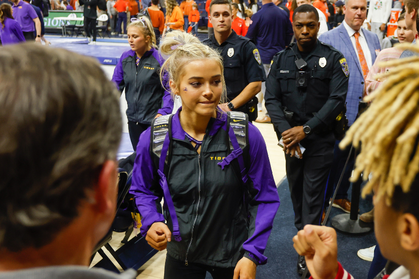 Olivia Dunne of LSU takes photos with fans after a gymnastics meet against Auburn at Neville Arena 