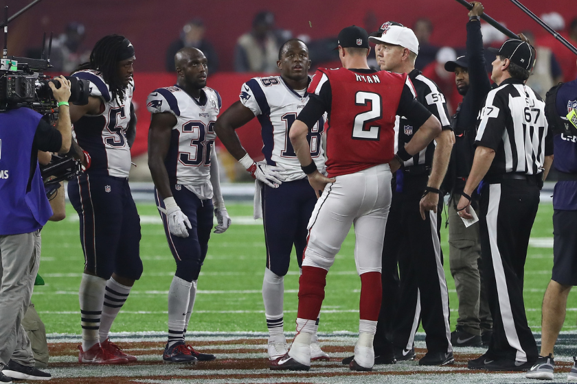 Matt Ryan #2 of the Atlanta Falcons awaits the overtime coin toss with Dont'a Hightower #54, Devin McCourty #32 and Matthew Slater #18 of the New England Patriots during Super Bowl 51