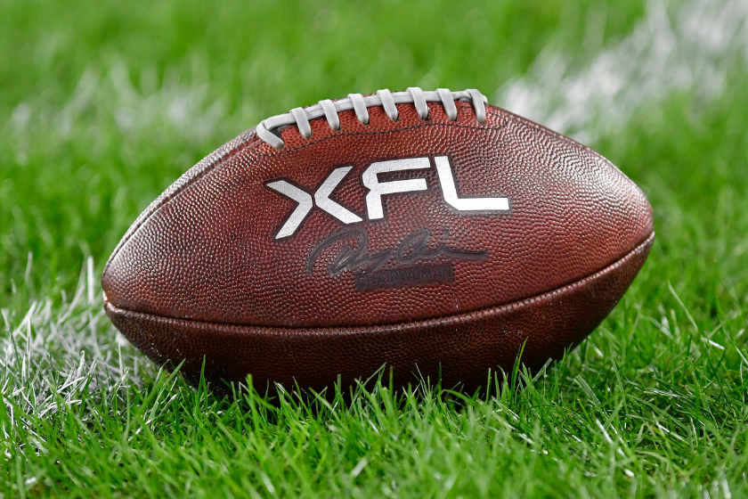 A close up of an XFL leather game football on natural turf grass during the Seattle Sea Dragons versus D.C. Defenders XFL football game