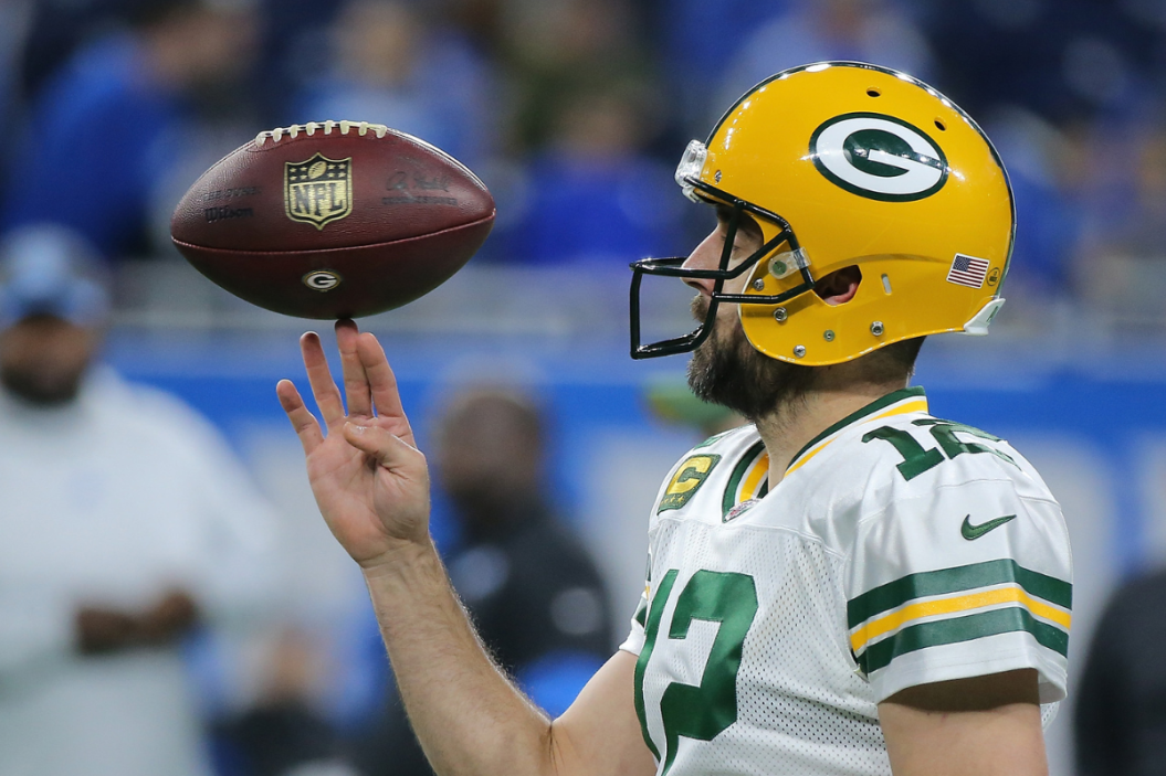 Aaron Rodgers #12 of the Green Bay Packers warms up prior to the start of the game against the Detroit Lions at Ford Field