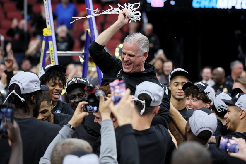 Head coach Brian Dutcher of the San Diego State Aztecs celebrates with the team after defeating the Creighton Bluejays in the Elite Eight round of the NCAA Men's Basketball Tournament