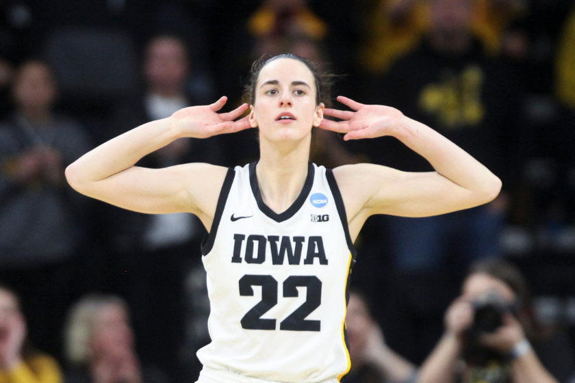 Guard Caitlin Clark #22 of the Iowa Hawkeyes gestures to the crowd after a basket against the Georgia Lady Bulldogs late in the second half during the second round of the NCAA Women's Basketball Tournament at Carver-Hawkeye Arena