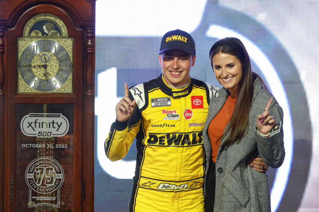 Christopher Bell and his wife Morgan Bell celebrate in victory lane after winning the 2022 Xfinity 500 at Martinsville Speedway