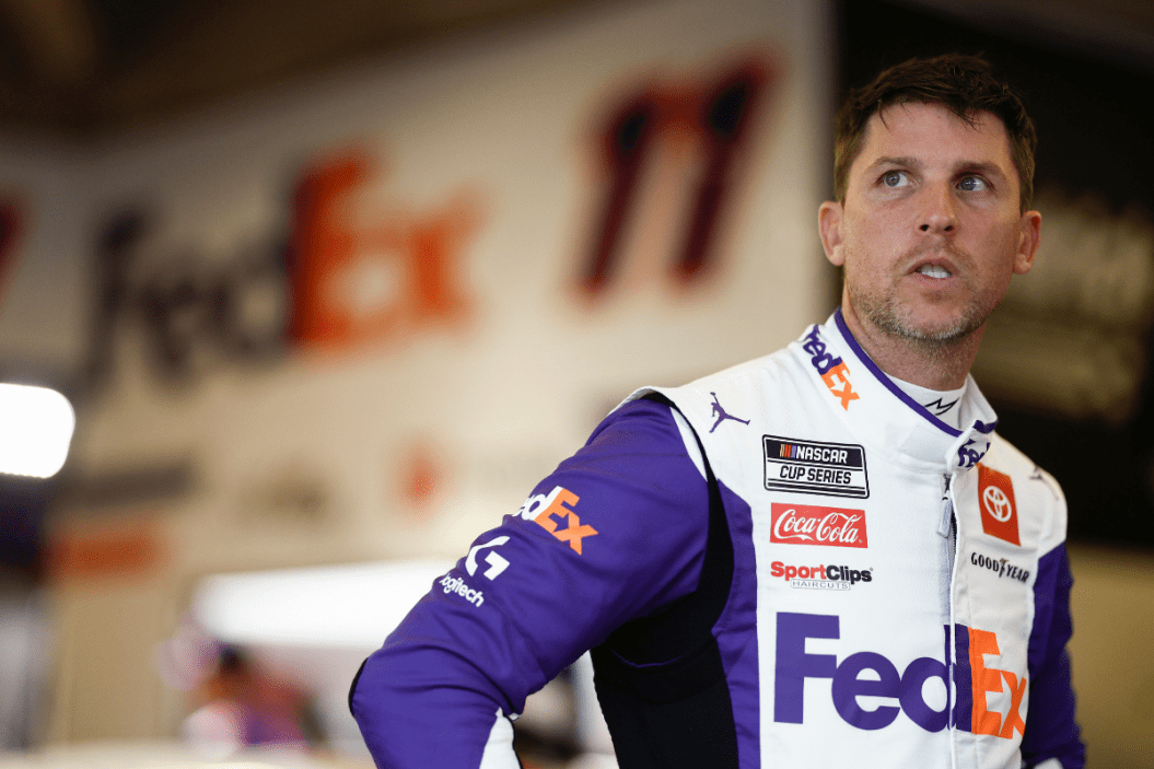 Denny Hamlin waits in the garage area during practice for the 2023 Daytona 500