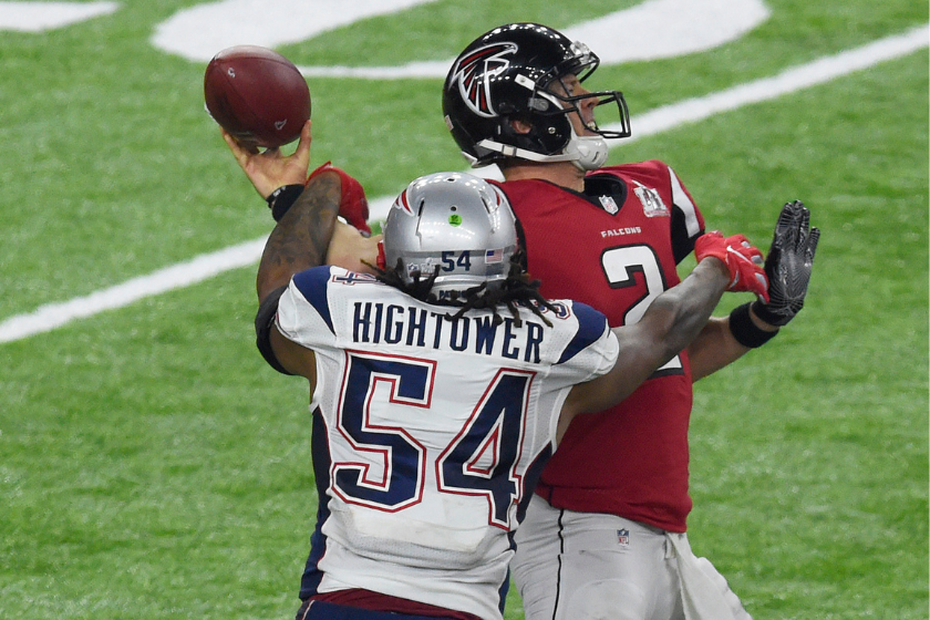 Matt Ryan #2 of the Atlanta Falcons looks to get his pass off under pressure from Dont'a Hightower #54 New England Patriots during Super Bowl 51 at NRG Stadium 