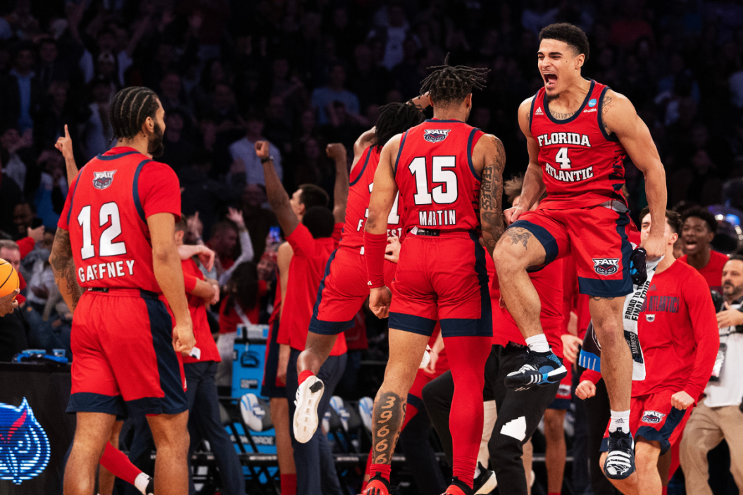 Jalen Gaffney #12 and Bryan Greenlee #4 of the Florida Atlantic Owls celebrate after defeating the Kansas State Wildcats in the Elite Eight round game of the NCAA Men's Basketball Tournament