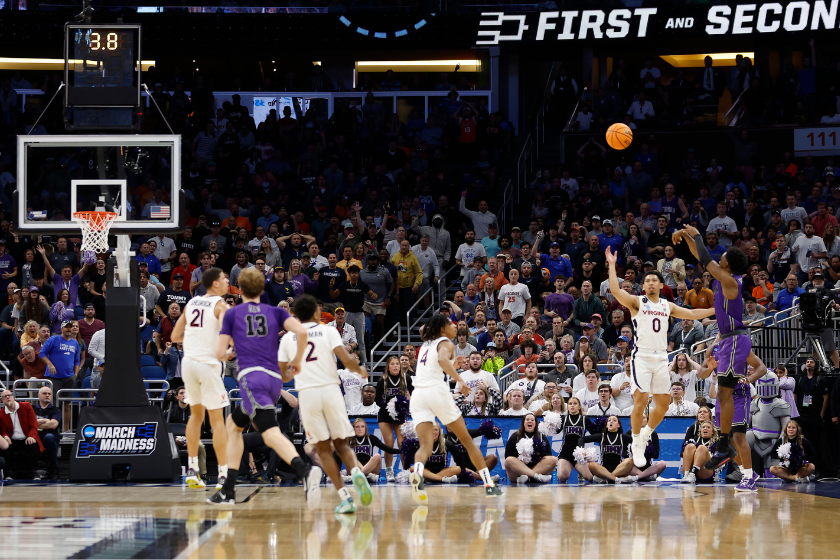 JP Pegues #1 of the Furman Paladins shoots the game winning three point basket against the Virginia Cavaliers during the second half in the first round of the NCAA Men's Basketball Tournament