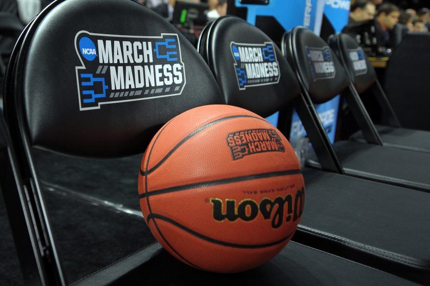 The March Madness logo on chairs.