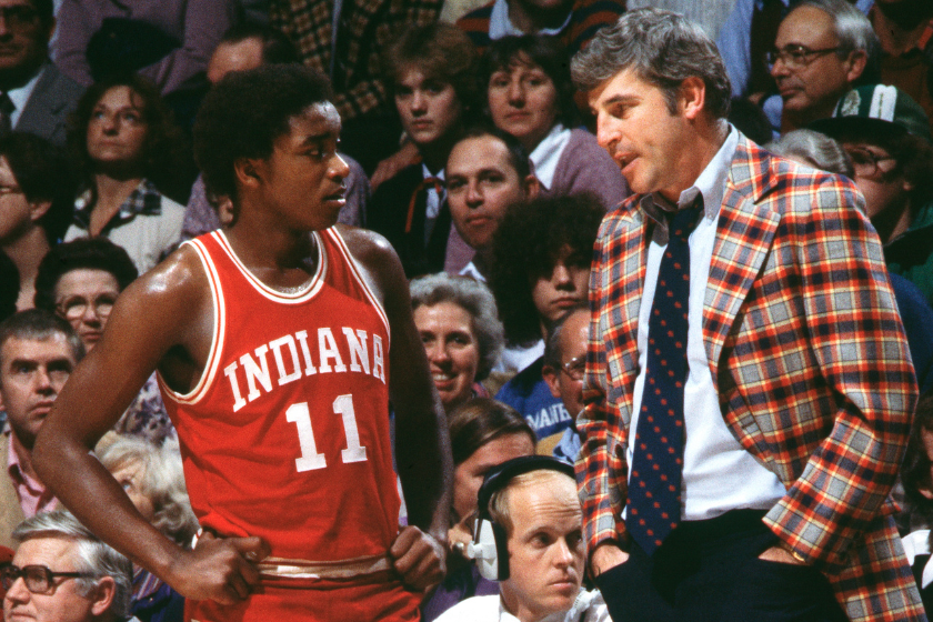  Head coach Bob Knight of the Indiana Hoosiers speaks with Isiah Thomas #11 during play against the Kansas State Wildcats