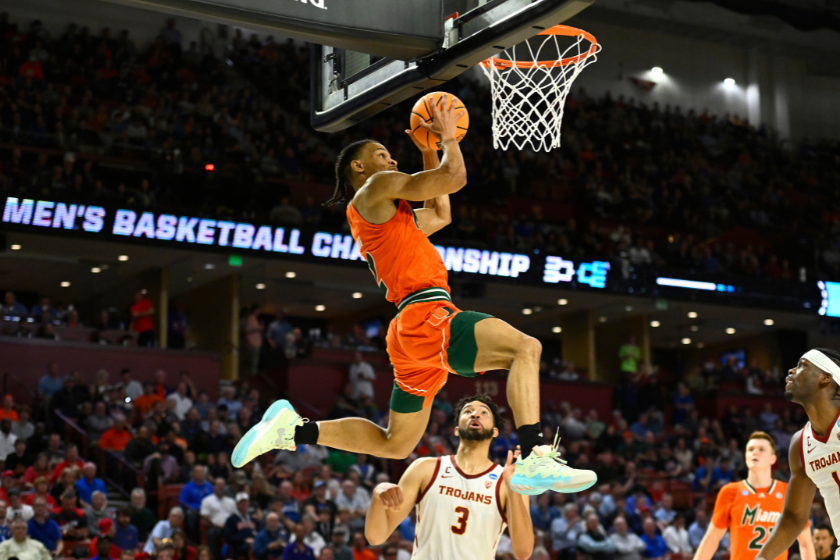 Isaiah Wong #2 of the Miami (Fl) Hurricanes completes a pass as he lays up against the USC Trojans during the first half in the first round game of the 2022 NCAA Men's Basketball Tournament 